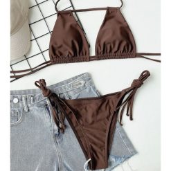 Strój kąpielowy z zapięciem na szyi do pływania i opalania Gulten. Brązowe stroje jednoczęściowe Intica, bez wzorów, z materiału. Za 149.00 zł.