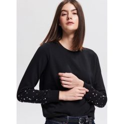 Bluza z aplikacjami - Czarny. Bluzy marki DOMYOS. W wyprzedaży za 39.99 zł.