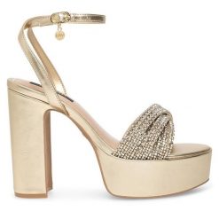 Sandały Nine West. Żółte sandały Nine West, bez wzorów, bez obcasa, na słupku, bez zapięcia. Za 259.99 zł.