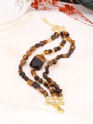 Pierres de Jade Pozłacana bransoletka z elementami ozdobnymi rozmiar: onesize. Brązowe bransoletki Pierres de Jade, pozłacane. Za 83.62 zł.