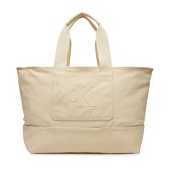 Torebka Calvin Klein Jeans. Brązowe shopper bag Calvin Klein Jeans, bez wzorów, z jeansu, bez dodatków. Za 309.99 zł.