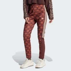 Spodnie dresowe adidas x FARM Rio Tiro. Niebieskie spodnie dresowe adidas, bez wzorów, z dresówki. Za 234.99 zł.