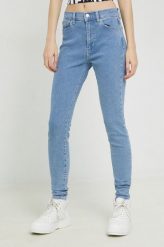 Tommy Jeans jeansy Sylvia damskie high waist. Niebieskie jeansy Tommy Jeans, bez wzorów, z denimu, z podwyższonym stanem. Za 449.99 zł.