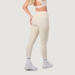 Legginsy damskie fitness z wysokim stanem NEO Almond. Brązowe legginsy sportowe GYMBEAM, s, bez wzorów, z elastanu, z podwyższonym stanem, na fitness i siłownię. Za 112.90 zł.