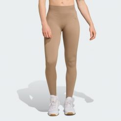 Długie dzianinowe legginsy do ćwiczeń Essentials. Zielone legginsy adidas, bez wzorów, z dzianiny, długie. Za 217.30 zł.