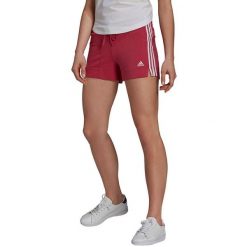 Spodenki damskie adidas Essentials Slim Short. Czerwone szorty adidas, bez wzorów, z bawełny, sportowe. Za 94.99 zł.