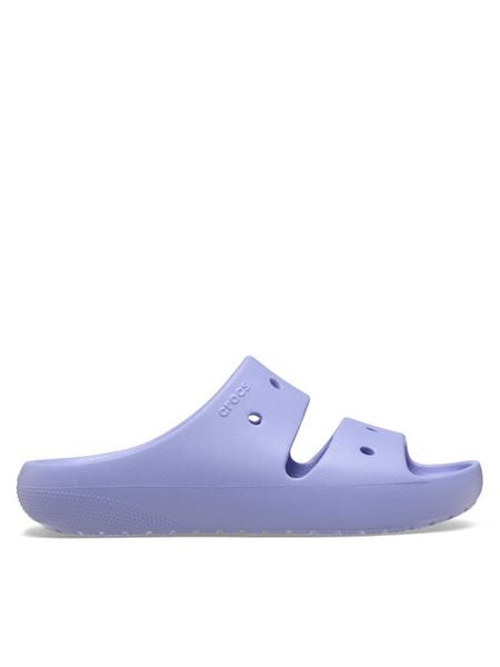 Crocs Klapki Classic Sandal v2 209403 Fioletowy. Fioletowe klapki Crocs, bez wzorów, z tworzywa sztucznego, bez obcasa, bez zapięcia. Za 135.15 zł.