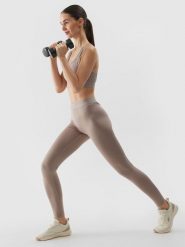 4F Legginsy treningowe z materiału z recyklingu damskie - beżowe L. Brązowe legginsy 4f, l, bez wzorów, z dzianiny, z podwyższonym stanem, na fitness i siłownię. W wyprzedaży za 69.99 zł.