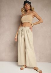 Beżowe Spodnie High Waist Szerokie z Bawełny Wiązane w Pasie z Gumką w Talii Yaslio. Brązowe jeansy Renee, bez wzorów, z bawełny, eleganckie, z podwyższonym stanem. W wyprzedaży za 29.99 zł.