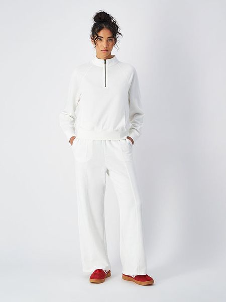 Champion Spodnie dresowe w kolorze białym rozmiar: XL. Białe spodnie dresowe Champion, bez wzorów, z dresówki. Za 127.95 zł.