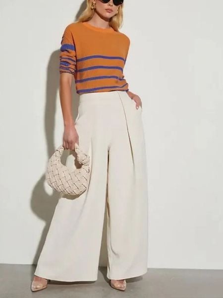 Milan Kiss Spodnie w kolorze kremowym rozmiar: S. Brązowe spodnie materiałowe Milan Kiss, bez wzorów, z materiału. Za 178.95 zł.