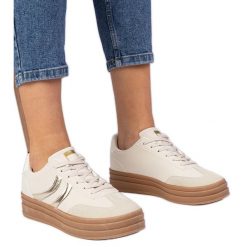Beżowe sneakersy trampki damskie z złotym dodatkiem beżowy. Brązowe trampki bez wzorów, z syntetyku, eleganckie, bez zapięcia. Za 96.19 zł.