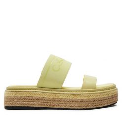 Klapki Calvin Klein. Żółte klapki Calvin Klein, bez wzorów, bez obcasa, bez zapięcia. Za 649.99 zł.