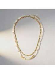 Nomad Pozłacany naszyjnik z elementami ozdobnymi - dł. 44,5 cm rozmiar: onesize. Białe naszyjniki Nomad, z materiału, z perłą, pozłacane. Za 188.80 zł.
