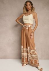 Brązowe Szerokie Spodnie z Wiskozy z Gumką w Talii Zdobione Etnicznym Wzorem Soleldi. Brązowe jeansy Renee, l, z aplikacjami, z jeansu, eleganckie, z podwyższonym stanem. W wyprzedaży za 39.99 zł.