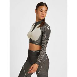 Damska bluza z zamkiem 1/2 crop Hummel MT Mila. Czarne bluzy Hummel, bez wzorów, sportowe, bez ramiączek, bez kaptura. W wyprzedaży za 213.50 zł.