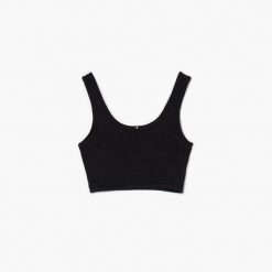 Czarny crop top - Czarny. Czarne topy Cropp, l, bez wzorów, z dzianiny, bez kołnierzyka, bez ramiączek. Za 39.99 zł.