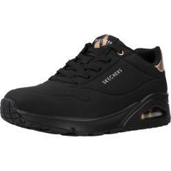Tenisówki Skechers Model Uno Kolor Czarny. Czarne trampki Skechers, bez wzorów, z gumy, sportowe, bez zapięcia. Za 349.99 zł.