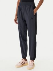 Adidas Spodnie dresowe Train Essentials 3-Stripes Woven KC5496 Czarny Regular Fit. Czarne spodnie dresowe adidas, bez wzorów, z dresówki, na fitness i siłownię. Za 219.99 zł.