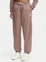 Reebok Spodnie dresowe Kalina RK25694CCW - LIGHT COCOA/LINEN Brązowy Relaxed Fit. Brązowe spodnie dresowe Reebok, bez wzorów, z dresówki. Za 259.99 zł.