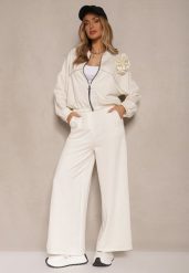 Jasnobeżowy Komplet Dresowy z Wiskozą Spodnie o Szerokim Kroju i Bluza z Broszką Redaella. Brązowe bluzy Renee, z aplikacjami, z dresówki, casualowe, bez ramiączek, bez kaptura. W wyprzedaży za 167.99 zł.