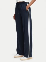 Guess Spodnie dresowe V6YB08 K4286 Granatowy Regular Fit. Niebieskie spodnie sportowe Guess, z aplikacjami, z dresówki. Za 434.99 zł.