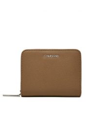 Calvin Klein Mały Portfel Damski Ck Must Md Zip Around_Caviar K60K612831 Beżowy. Brązowe portfele Calvin Klein, bez wzorów, ze skóry. Za 199.99 zł.