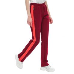 Spodnie dresowe damskie Fila Nery Track. Czerwone spodnie dresowe Under Armour, bez wzorów, z bawełny, sportowe. Za 228.00 zł.