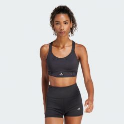 Biustonosz FastImpact Luxe Run High-Support. Niebieskie biustonosze sportowe adidas, bez wzorów, z materiału, na fitness i siłownię. Za 349.00 zł.