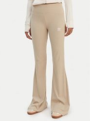 Adidas Legginsy Essentials KD3850 Beżowy Flared Leg. Brązowe legginsy adidas, bez wzorów, z bawełny. Za 219.99 zł.