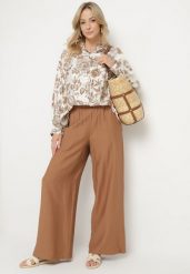 Jasnobrązowy Komplet Wiskozowy z Koszulą w Kwiaty i Szerokimi Spodniami Hanalore. Brązowe koszule Born2be, l, bez wzorów, z materiału, eleganckie, bez kołnierzyka, bez ramiączek. Za 169.99 zł.