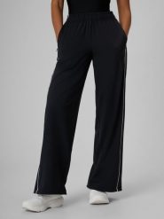 4F Spodnie z szerokimi nogawkami szybkoschnące damskie - czarne XL. Czarne spodnie dresowe 4f, bez wzorów, z dresówki, na fitness i siłownię. Za 159.99 zł.