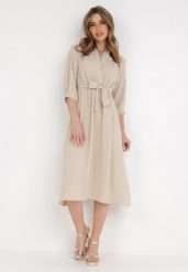 Beżowa Sukienka Rheniolea. Brązowe sukienki Born2be, m, bez wzorów, eleganckie, bez kołnierzyka, bez ramiączek, midi, kopertowe. Za 129.99 zł.
