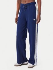 Adidas Spodnie dresowe Firebird KW2605 Niebieski Regular Fit. Niebieskie spodnie dresowe adidas, bez wzorów, z dresówki. Za 314.99 zł.