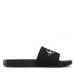 Klapki Calvin Klein Jeans. Czarne klapki Calvin Klein Jeans, bez wzorów, z jeansu, bez obcasa, bez zapięcia. Za 129.99 zł.