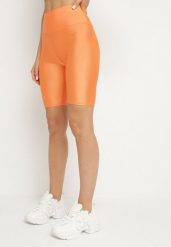 Pomarańczowe Kolarki Xilkas. Brązowe szorty Born2be, bez wzorów. Za 49.99 zł.