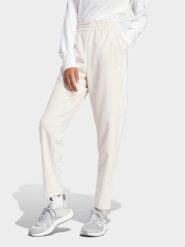 Adidas Spodnie dresowe Train Essentials IS3969 Różowy Loose Fit. Czerwone spodnie dresowe adidas, bez wzorów, z dresówki. Za 129.99 zł.