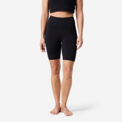 Legginsy do jogi i pilatesu damskie Domyos. Czarne legginsy DOMYOS, bez wzorów, z materiału, krótkie. Za 69.99 zł.