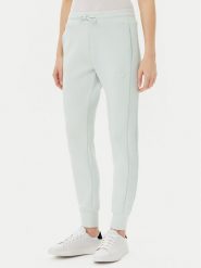Guess Spodnie dresowe V2YB18 K7UW2 Zielony Regular Fit. Zielone spodnie dresowe Guess, z aplikacjami, z dresówki. Za 249.99 zł.