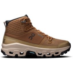 Buty damskie On Cloudrock Mid Waterproof. Brązowe buty trekkingowe On, z gumy, przed kolano, bez zapięcia. Za 879.99 zł.