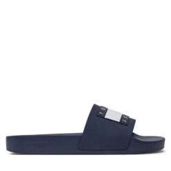 Klapki Tommy Jeans. Niebieskie klapki Tommy Jeans, bez wzorów, z jeansu, bez obcasa, bez zapięcia. Za 129.99 zł.