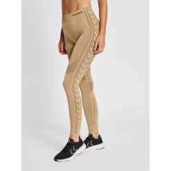 Damskie legginsy mid-rise Hummel Shaping. Brązowe legginsy Hummel, bez wzorów, sportowe. Za 138.00 zł.
