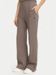 Calvin Klein Jeans Spodnie dresowe Monogram LV047H220G Beżowy ciemny Flare Fit. Brązowe spodnie sportowe Calvin Klein Jeans, bez wzorów, z bawełny. Za 369.99 zł.