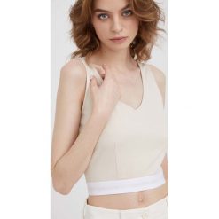 Calvin Klein Jeans top J20J218278.PPYY damski kolor beżowy. Brązowe topy Calvin Klein Jeans, l, bez wzorów, z jeansu, bez kołnierzyka, bez ramiączek. W wyprzedaży za 119.99 zł.