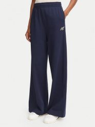 Lacoste Spodnie dresowe XF8392 Granatowy Flare Fit. Niebieskie spodnie dresowe Lacoste, bez wzorów, z bawełny. Za 579.99 zł.