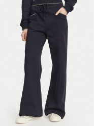 Guess Spodnie dresowe W6YB31 K5319 Granatowy Wide Leg. Niebieskie spodnie dresowe Guess, z aplikacjami, z bawełny. Za 434.99 zł.