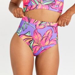 Dół kostiumu kąpielowego surfingowego damski Olaian Rosa Longi. Fioletowe bikini OLAIAN, bez wzorów, z elastanu, sportowe. W wyprzedaży za 39.99 zł.