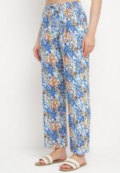 Niebieskie Szerokie Spodnie z Wiskozy w Abstrakcyjny Print z Gumką w Pasie Sumiesa. Niebieskie jeansy Born2be, l, bez wzorów, z jeansu. Za 59.99 zł.