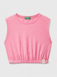 Benetton Top w kolorze jasnoróżowym rozmiar: 130. Różowe topy Benetton, bez wzorów, z bawełny, bez kołnierzyka, bez ramiączek. Za 26.38 zł.