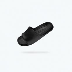 Klapki NATIVE SPENCER LX. Czarne klapki Native Shoes, bez wzorów, bez obcasa, bez zapięcia. Za 139.99 zł.
